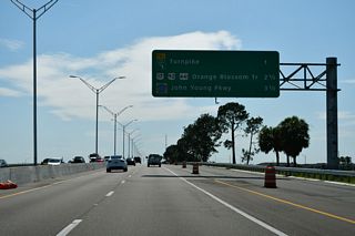 A systems interchange (Exit 12) joins SR 417 south with Florida's Turnpike north to Orlando and Clermont and south to Kissimmee and St. Cloud in one mile.