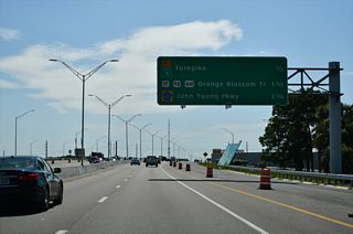 Three exits depart in quick succession as the Central Florida GreeneWay progresses west through the Hunters Creek community.