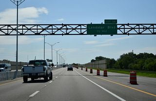 SR 417 south reaches the diamond interchange (Exit 14) with Landstar Boulevard in one half mile.