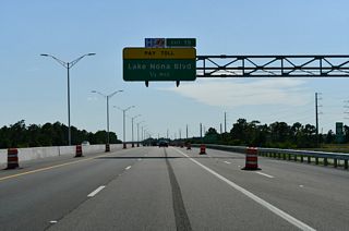 Lake Nona Boulevard navigates southwest from Narcoossee Road along a circuitous course to Exit 19 and Boggy Creek Road south of Exit 17. The arterial was completed west from Medical City by 2016.