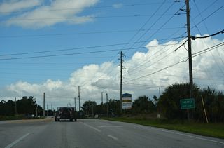 CR 561 northbound reaches the Taveras city limits at Southridge Industrial Drive.
