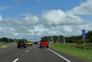 Another CR 54 trailblazer precedes the traffic light between Bruce B. Downs Boulevard and Chancey Road. SR 54 along Wesley Chapel Boulevard west was transferred by FDOT following the completion of SR 56 in 2002. Those actions included redesignating CR 581 as SR 581 along this stretch. SR 54 east to Zephyrhills was renumbered to CR 54 in 2025.