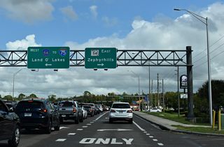 CR 581 concludes at Wesley Chapel Boulevard where CR 54 east and SR 54 west formerly came together. Big box retail, fast food restaurants and car dealerships line the forthcoming six lane arterial.