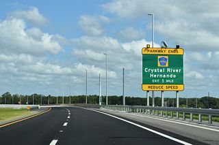 SR 589 arcs northwest 2.3 miles from SR 44 to CR 486 (Norvell Bryant Highway).