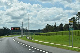 SR 589 (Suncoast Parkway) arcs southward from the wye interchange at Exit 70 to SR 44 (Gulf to Lake Highway).