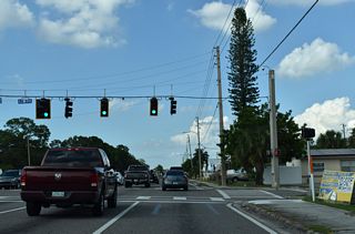 82nd Avenue N intersects 49th Street N at the next traffic light northbound.