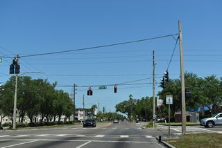 The succeeding traffic light on 49th Street N northbound is at 9th Avenue N.