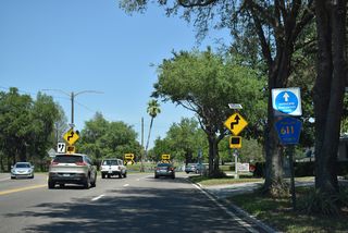 North from 22nd Avenue N, CR 611 (49th Street N) separates into a couplet around Lake Sheffield.