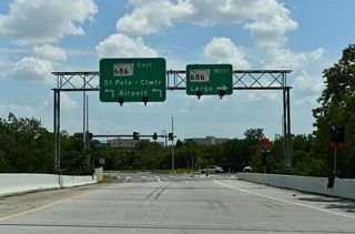 Westward from CR 611, Roosevelt Boulevard becomes E Bay Drive at U.S. 19 en route to Largo and W Bay Drive (CR 416) to Belleair Bluffs.