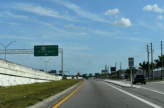 The entrance ramp connecting SR 686 (Roosevelt Boulevard) with U.S. 19 joins the freeway ahead of the separation with SR 693 (66th Street N).