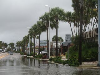 The first confirming marker for SR 693 north stands at the intersection with Boca Ciega Drive near St. Pete Beach City Hall. Flood waters in this scene were from Tropical Storm Barry.