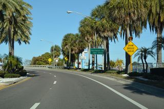 SR 693 curves northeast onto the bridges spanning Boca Ciega Bay by Colonel Michael J. Horan Park.