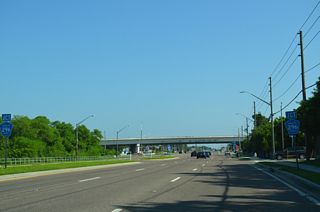 SR 693 (66th Street N) meets CR 296 (Bryan Dairy Road) at a SPUI beyond Cross Bayou Canal.