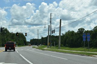 Henley Road formerly curved east onto Russell Road (CR 209). Widening of CR 739 straightened out the arterial route and reconfigured CR 209 west into a T-intersection with Henley Road.
