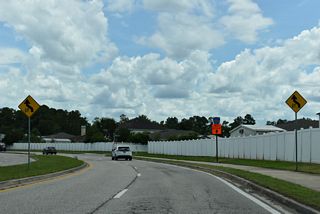 Henley Road shifts a quarter mile east through an S-curve at Carlotta Road.