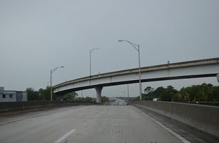 A 70 foot high flyover ramp shuttles motorists from SR 10 eastbound onto SR A1A/101 (Mayport Road) north. The overpass was constructed from January 2000 to March 2002.