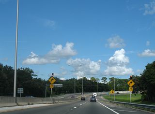 Flashing beacons and regulatory signs accompanied the reduction in speed at the U.S. 1 Alternate turn.