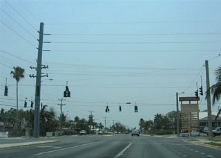 Monroe County Road C5A (Flagler Avenue) westbound at the signalized intersection with Kennedy Drive. Kennedy Drive heads north to Sigsbee Road at U.S. 1. A variety of businesses lie along Kennedy Drive nearby and along U.S. 1 (North Roosevelt Boulevard) at Kennedy Drive. Several ball fields and Poinciana Elementary School lie along Kennedy Drive as well.