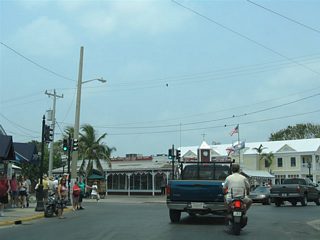 Front Street serves the Downtown Key West tourist district and cruise terminal area between Greene and Simonton Streets. Area attractions include Mallory Square, the Key West Art Center, and the Key West Shipwreck Museum. Front Street eastbound intersects Duval Street in this scene.