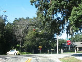 Beggs Road travels 2.25 miles west from Rose Avenue at Edgewater Drive to Lakeville Road in unincorporated Orange County. Passing below U.S. 441, Beggs Road is part of unsigned CR 424 between Edgewater Drive and Apopka Boulevard. Pictured here is the west end of Beggs Road at Lakeville Road.