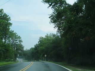 Removed by 2011, a confirming marker for County Road 20A was previously posted at the eastbound beginning of the loop.