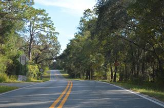 Curving southeast toward Mc Meekin, CR 20A lowers from 162 feet above sea level at SR 20/21 to 107 feet at Cowpen Lake.
