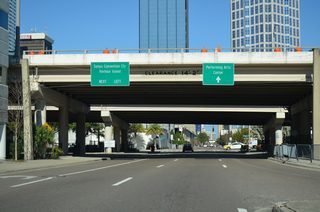 A loop ramp connects the eastbound Selmon Expressway with Florida Avenue north ahead of Brorein Street. Signs direct oncoming traffic from SR 618 to Harbour Island and Downtown area points of interest.