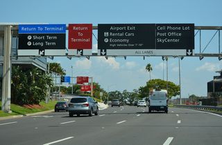 George J. Bean Parkway leaves the passenger terminal area with four southbound lanes.