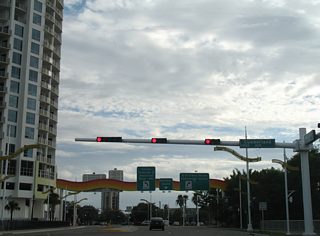 Cumberland Avenue passes under the parking garage ahead of a roundabout with Channelside Drive. A separate section of the avenue exists west of the adjacent railroad tracks.