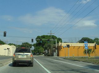 SR 585 previously followed a one way street couplet of 21st & 22nd Streets through Ybor City between Adamo Drive (SR 60) and 22nd Avenue. 22nd Street leads drivers north from Palm Avenue to Exit 1 of Interstate 4.
