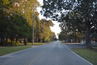 County Road 77A branches south from SR 77 (Main Street) along Falling Waters Road. The route is unmarked along this stretch.