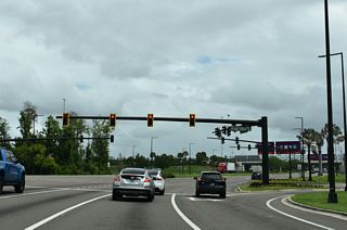 Backstage Lane extends south from ramps joining Epcot Center Drive with Overpass Road to intersect Buena Vista Drive across from Chelonia Parkway.