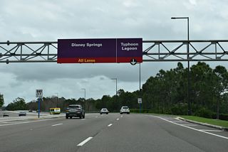 Continuing east from Bonnet Creek Parkway and Epcot Center Drive, the next signalized intersection along Buena Vista Drive connects with the entrances to the Typhoon Lagoon water park and Disney Springs.