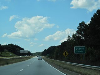 U.S. 29 south, U.S. 78 west and SR 10 Loop inner cross McNutt Creek into Oconee County within the parclo interchange at Timothy Road.