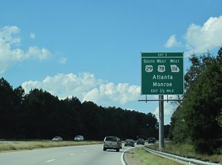 U.S. 78 angles southwest from U.S. 29, 3.7 miles west of Exit 1, along a four lane divided highway to the Walton County seat of Monroe.