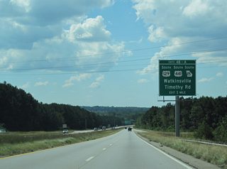 U.S. 129/441 and SR 15 branch south from SR 10 Loop at the subsequent westbound exit for Macon Highway south and Timothy Road north.