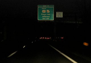 Approaching Exit 14 (old Exit 7) with U.S. 129/SR 15 Alternate (Prince Avenue) on SR 10 Loop eastbound. Prince Avenue angles southeast from the freeway to Downtown Athens, partially along the former route of U.S. 129/441. U.S. 129 north travels 15 miles to Jefferson.
