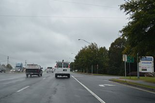Distance sign referencing Sugar Hill at one mile, Cumming at 11 miles and Buford Dam at seven miles, posted west of SR 13 on SR 20 (Buford Highway).