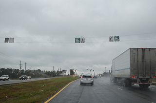 SR 20 (Buford Highway) proceeds northwest from Market Place Boulevard into a parclo interchange (Exit 14) with U.S. 19/SR 400.