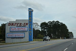 Continuing south from SR 42SP (McDonough Boulevard), U.S. 23/SR 42 line the west side of the Starlight Drive-In Theatre.