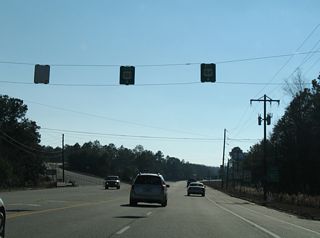 U.S. 25/301 separate with U.S. 84 west along a controlled access arterial bypass of Jesup.