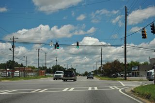 U.S. 41BU/129 (Broadway) advance 0.6 miles north from the roundabout with U.S. 41/SR 247 (Pio Nono Avenue) to the traffic light at Guy Paine Road.