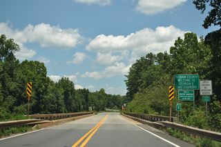 Crossing Cedar Creek, U.S. 129/SR 44 (Eatonton Highway) enter Putnam County.