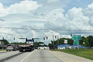 SR 347 ends at SR 211 eight miles to the east of I-985 / U.S. 23 by the northern wedge of Gwinnett County.