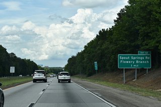 Exit 12 connects I-985 / U.S. 23 with Phil Niekro Boulevard west and Spout Springs Road south in one mile.