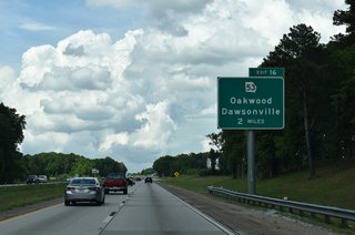 The succeeding exit along I-985 / U.S. 23 northbound is with SR 53 (Mundy Mill Road) in Oakwood.