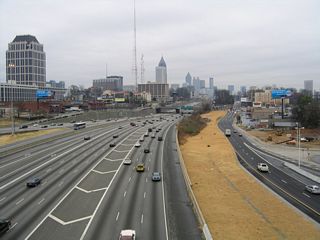 The exit ramps joining I-75/85 south with 14th Street (U.S. 19/SR 9) were constructed in the grassy area between the Downtown Connector and Techwood Drive at 16th Street.