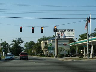 Waters Avenue north at DeRenne Avenue. DeRenne Avenue becomes Georgia 21 west at parallel Georgia 204 (Abercorn Street).