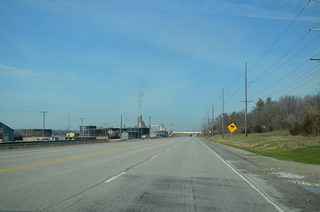 Narrowing to a four lane boulevard, Iowa 22 (Front Street) crosses into Buffalo at Utah Avenue.