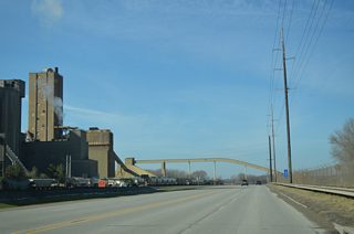 Continuing west, Front Street passes by a cement plant. The industrial riverfront gives way to a residential street grid as Iowa 22 nears the Buffalo city center.